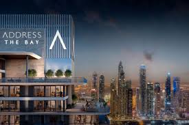 Luxury hotel with city skyline at dusk.